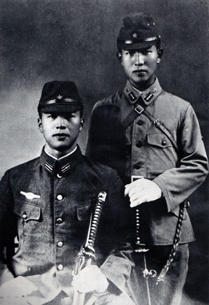 Hiroo Onoda (standing) and his younger brother  Shigeo during the war