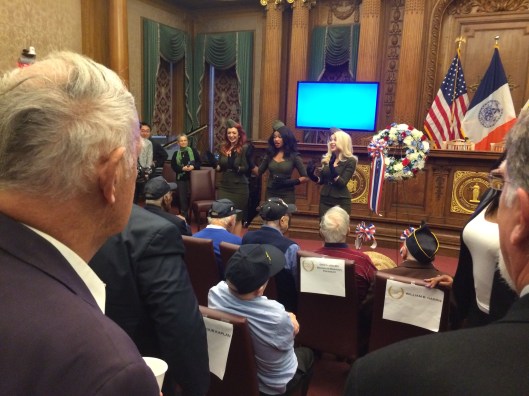 An a cappella trio doing period songs also performed.